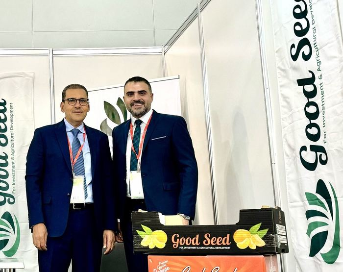 Good Seed's founders at the company stand with a carton of Egyptian mango